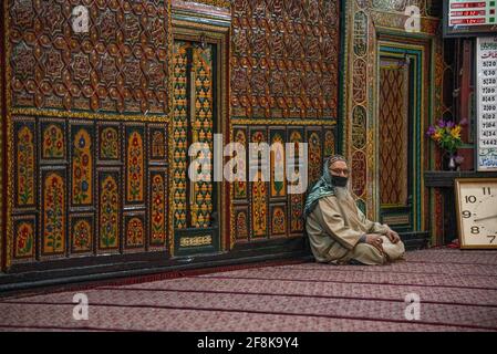 Srinagar, India. 14th Apr, 2021. A Kashmiri man reading the Islamic ...