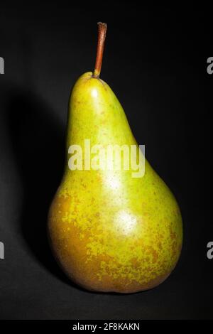 green pear on black background Stock Photo
