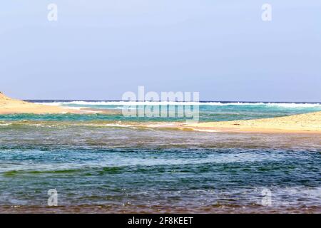 Beautiful shot of blue ocean waves under a clear skky Stock Photo