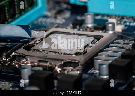 thermal paste is applied to a processor Stock Photo