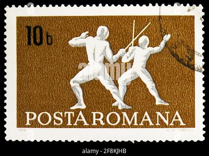 MOSCOW, RUSSIA - NOVEMBER 10, 2019: Postage stamp printed in Romania shows Fencing, Sports serie, circa 1969 Stock Photo