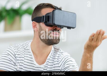 man using virtual reality googles Stock Photo