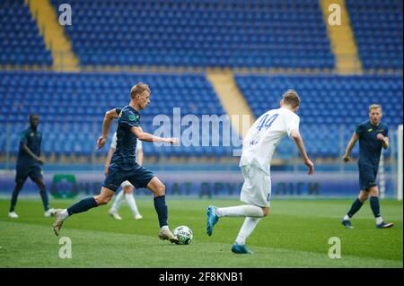 KHARKIV, UKRAINE - APRIL 14, 2021: The football match of Professional football league. FC Metal Kharkiv vs FC Peremoha Stock Photo