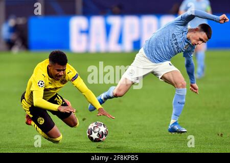 Manchester City's Phil Foden (right) and Borussia Dortmund's Ansgar Kanuff battle for the ball during the UEFA Champions League, quarter final, second leg match at Signal Iduna Park in Dortmund, Germany. Picture date: Wednesday April 14, 2021. See PA story SOCCER Man City. Photo credit should read: PA Wire via DPA. RESTRICTIONS: Editorial use only, no commercial use without prior consent from rights holder.