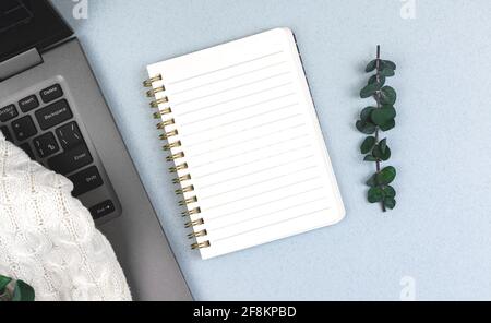 Business office desktop, mockup with blank notepad, top view laptop on the table Stock Photo