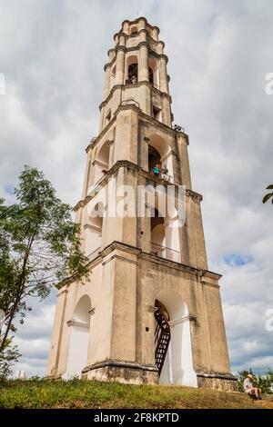 IZNAGA, CUBA - FEB 9, 2016: Manaca Iznaga tower in Valle de los Ingenios valley near Trinidad, Cuba. Tower was used to watch the slaves working on sug Stock Photo