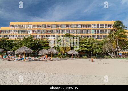 PLAYA ANCON, CUBA - FEB 9, 2016: View of Playa Ancon beach near Trinidad, Cuba. Hotel Club Amigo Ancon in the background. Stock Photo