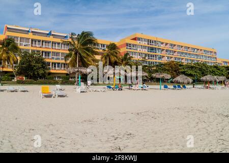 PLAYA ANCON, CUBA - FEB 9, 2016: View of Playa Ancon beach near Trinidad, Cuba. Hotel Club Amigo Ancon in the background. Stock Photo