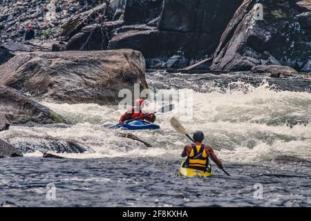 A kayaker shoots the rapids on the Salmon River in the Frank Church River of No Return Wilderness in Idaho. Stock Photo