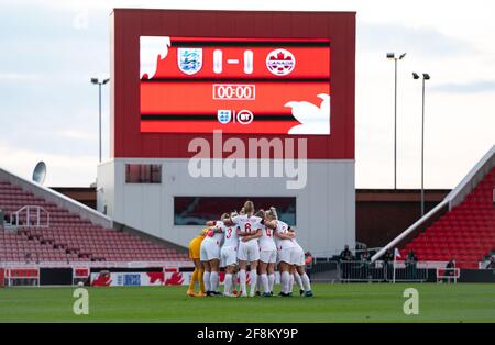 Stoke On Trent, UK. 13th Apr, 2021. England pre match team huddle during the International friendly match played behind closed doors, between England Women and Canada Women at the Britannia Stadium, Stoke-on-Trent, England on 13 April 2021. Photo by Andy Rowland. Credit: PRiME Media Images/Alamy Live News Stock Photo