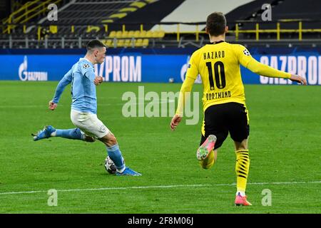 Manchester City's Phil Foden scores their side's second goal of the game during the UEFA Champions League, quarter final, second leg match at Signal Iduna Park in Dortmund, Germany. Picture date: Wednesday April 14, 2021. See PA story SOCCER Man City. Photo credit should read: PA Wire via DPA. RESTRICTIONS: Editorial use only, no commercial use without prior consent from rights holder.