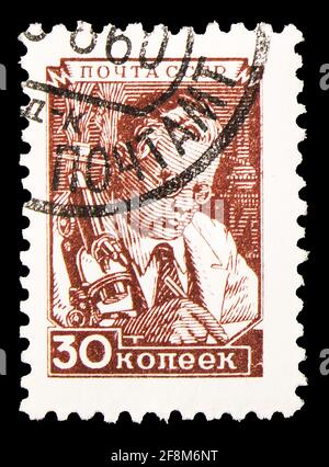 MOSCOW, RUSSIA - SEPTEMBER 30, 2019: Postage stamp printed in Soviet Union (Russia) shows Scientist at microscope, Definitive Issue No.8 serie, circa Stock Photo