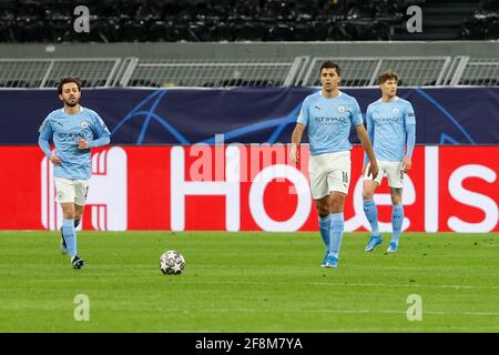 DORTMUND, GERMANY - APRIL 14: Bernardo Silva of Manchester City, Rodri of Manchester City and John Stones of Manchester City disappointed during the U
