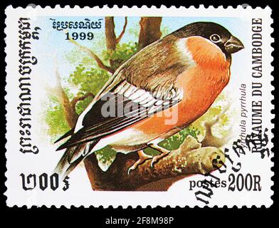 MOSCOW, RUSSIA - OCTOBER 4, 2019: Postage stamp printed in Cambodia shows Eurasian Bullfinch (Pyrrhula pyrrhula), Birds serie, circa 1999 Stock Photo
