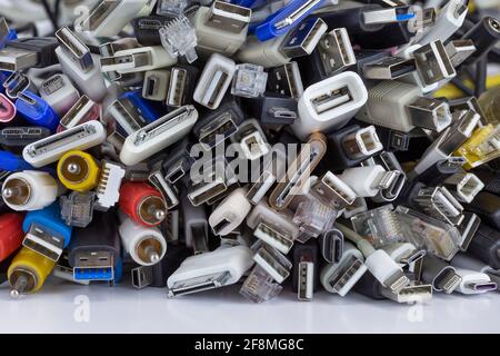 Heap a Lot Of USB (Universal Serial Bus) cables Connectors plugs universal standart for computer different types cables and Ports peripheral. Macro Stock Photo