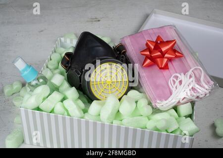 Pinc Medical protective masks and raspirator and disinfection Hand sanitizer in box with Green Polystyrene Foam Peanuts Packaging Filler Cushioning Stock Photo