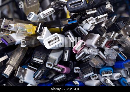 Heap a Lot Of USB (Universal Serial Bus)  cables Connectors plugs universal standart for computer different types cables and Ports peripheral Stock Photo