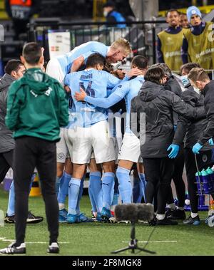 Dortmund, Germany. 14th Apr, 2021. Players of Manchester City celebrate the scoring of Phil Foden during a UEFA Champions League quarterfinal second leg match between Borussia Dortmund and Manchester City in Dortmund, Germany, April 14, 2021. Credit: Joachim Bywaletz/Xinhua/Alamy Live News