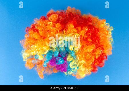 Funny Party concept Rainbow Clown Wig Fluffy Afro Synthetic Cosplay Anime Fancy Wigs Festive Background Stock Photo