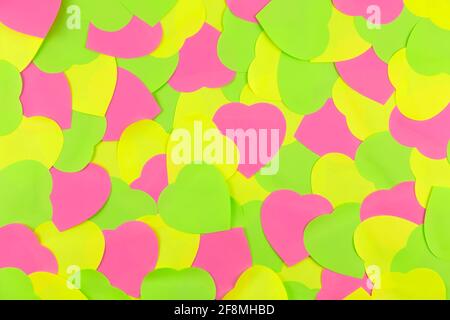 Closeup to Neon  sticky notes in heart form shape. Love in Valentine's Day Date Idea art concept Stock Photo