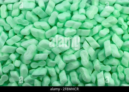 Green Polystyrene Foam Packaging Filler Peanuts Cushioning Material Texture Background Stock Photo