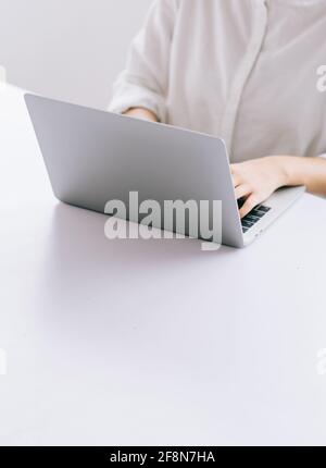 Cropped image of Asian business woman using laptop Stock Photo