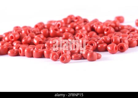 Close up of red Beads on the white background Background macro, make bead necklace Stock Photo
