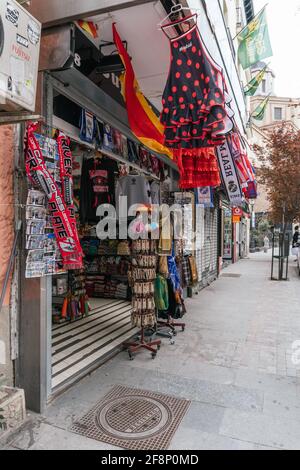 MADRID, SPAIN - Mar 25, 2021: Madrid souvenir shop with flamenco dresses and scarves from the Barcelona and Real Madrid historic clubs Stock Photo