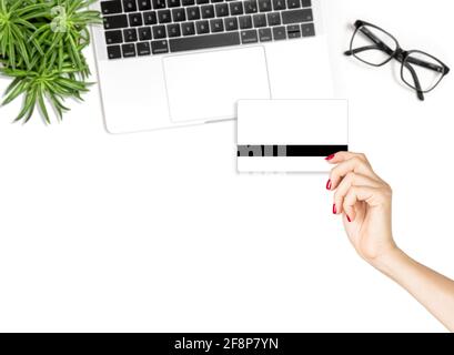 Online shopping concept. Female hand holding credit card. Fashion flat lay blog social media