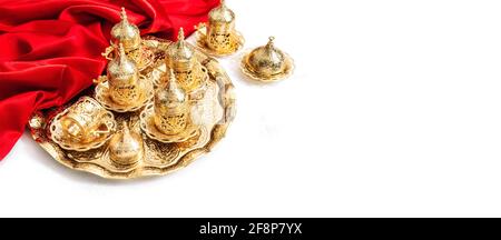 Oriental holidays decoration. Arabic tea coffee golden service. Ramadan kareem Stock Photo