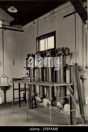 Air liquefaction system of K.U.K. Genowning in Klagenfurt, Azetznodron Cleaner Bottles and Workers. Stock Photo