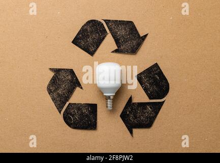 LED light bulb with recycle symbol on craft paper Stock Photo