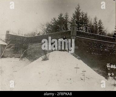 Soldier graves in the iron cross on the wall corner of the castle park Pilica. . Stock Photo