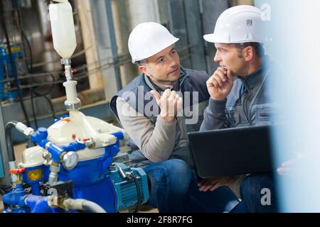 maintenance workers pressure at brewery factory Stock Photo