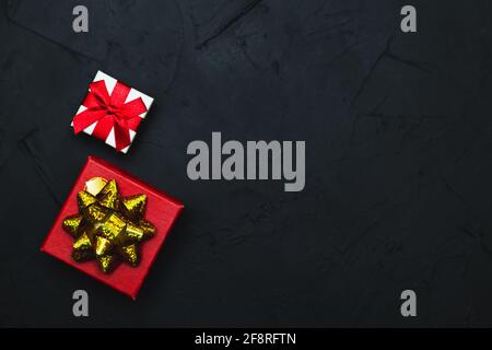 Gift boxes on a dark background. Flat lay, low key. Stock Photo