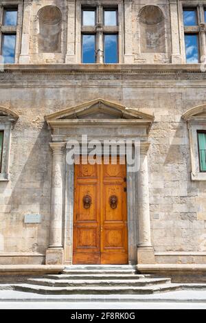 Ornate Wooden Double Doors in Pillared Stone Doorway with Lion Door Knockers Stock Photo