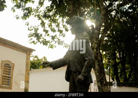 Tiradentes, Minas Gerais, Brazil - February 20, 2021: Tiradentes metal statue representing the young ensign on a public road Stock Photo