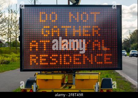 Taplow, Buckinghamshire, UK. 15th April, 2021. Following the sad passing of Prince Philip, a private funeral will be held at St George's Chapel in the grounds of Windsor Castle on Saturday 17th April 2021. Given the Covid-19 restrictions, a large LED sign on the A4 tells locals not to gather at Royal residences, however, it is expected that many people will still go into Windsor on Saturday. Credit: Maureen McLean/Alamy Live News Stock Photo