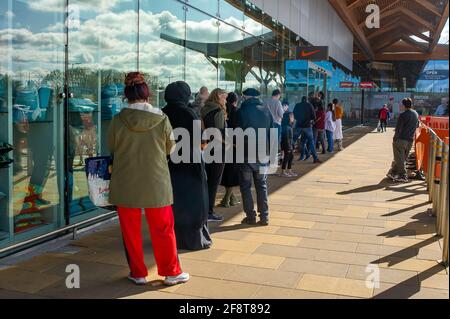 Taplow, Buckinghamshire, UK. 15th April, 2021. Following the easing of some of the Coronavirus Covid-19 lockdown restrictions this week, shoppers were queuing outside the Nike store at the Bishop Centre in Taplow this morning waiting for the store to open. Non essential shops in England have now reopened as have gyms so people are out buying sports gear and leisurewear. Credit: Maureen McLean/Alamy Live News Stock Photo