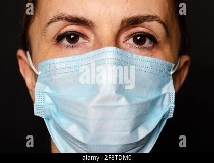 Woman Wearing a Face Mask, Close Up Stock Photo
