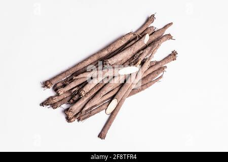 Raw Scorzonera or Spanish salsify isolated on white background. Very healthy vegetable, modern ingredient for a vegan or vegetarian diet. Contains man Stock Photo