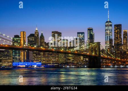 Brooklyn Bridge, New York with Manhattan skyline and Pier 16 and Pier 17 in the background, New York city USA Stock Photo