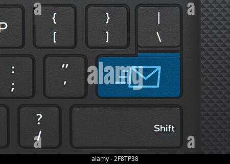 Email icon on computer keyboard key. Email delivery Stock Photo