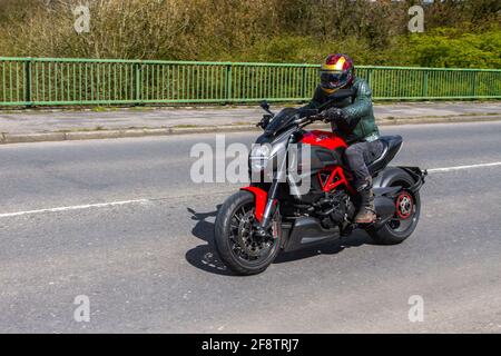 2012 Ducati Diavel; Motorbike rider; two wheeled transport, motorcycles, vehicle on British roads, motorbikes, motorcycle bike riders motoring in Manchester, UK Stock Photo