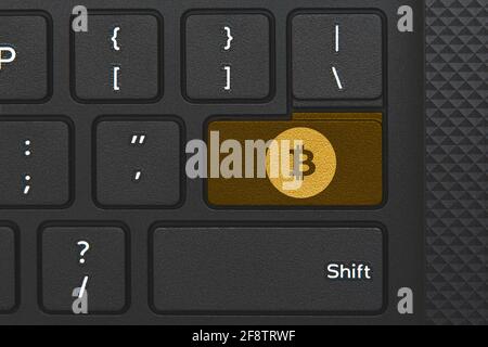 Bitcoin icon on keyboard key. Conceptual idea of cryptocurrency Stock Photo