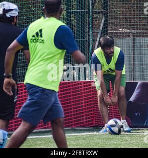 New Delhi, India - July 19 2019: Footballers of local football team during game in regional Derby championship on a bad football pitch. Hot moment of Stock Photo