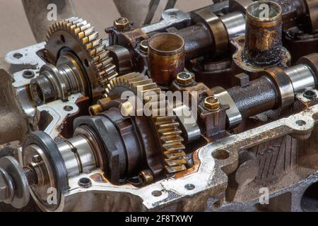 camshaft gears on the head of the car engine. Car engine repair. Stock Photo