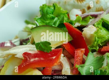 Tinga de Pollo - Slow-Cooker Chicken Tinga, Mexican stew of chicken, tomato, onion, and chipotle peppers. Stock Photo