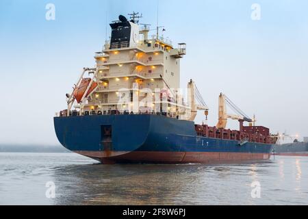 A big cargo ship anchored at the port of Corral in southern Chile. Stock Photo