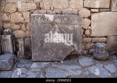 Bas reliefs on the ancient stone. religious patterns carved in stone. christian sign. antique Stock Photo